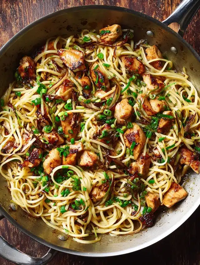3. Sauté the Chicken Heat a splash of oil in a large skillet over medium‑high heat, add the chicken, and cook until golden brown. Pour in your sticky sauce and let it simmer. The aroma of these Sticky Garlic Chicken Noodles | Easy Weeknight Dinner cooking will pull everyone into the kitchen.
