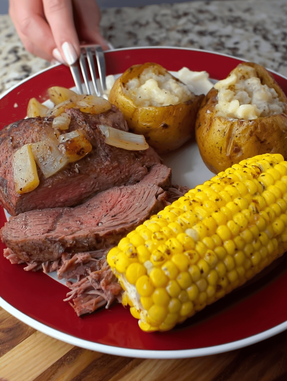 roast beef dinner with corn on the cobb and baked potatoes in the slow cooker
