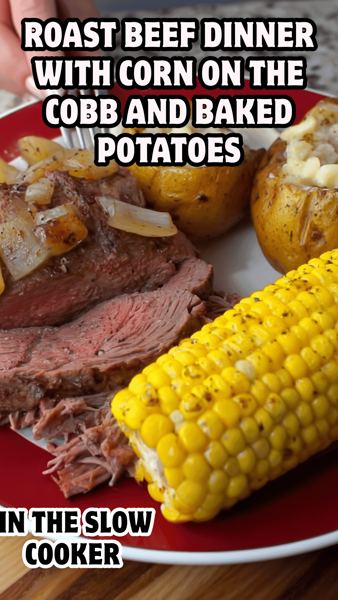 roast beef dinner with corn on the cobb and baked potatoes